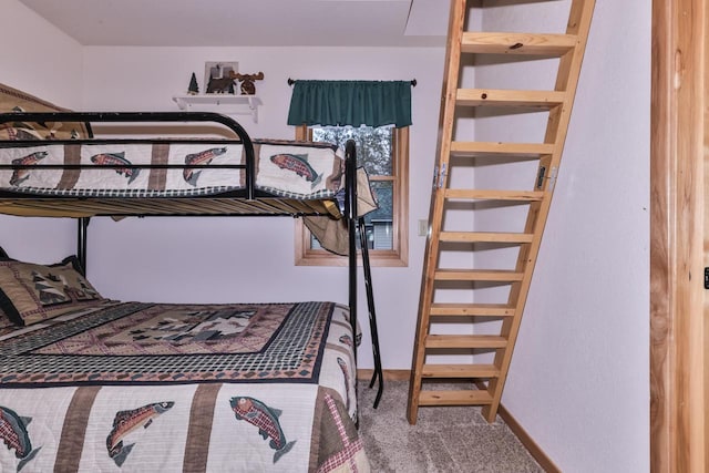 carpeted bedroom with baseboards