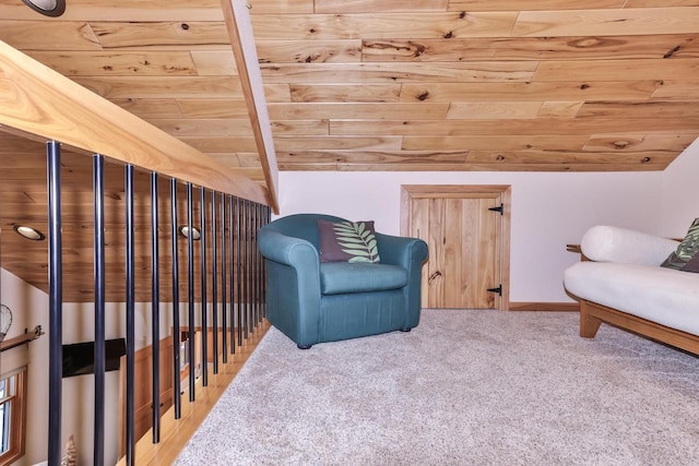 living area with vaulted ceiling, carpet flooring, wood ceiling, and baseboards