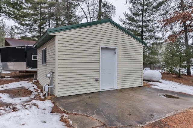 snow covered structure with a sunroom