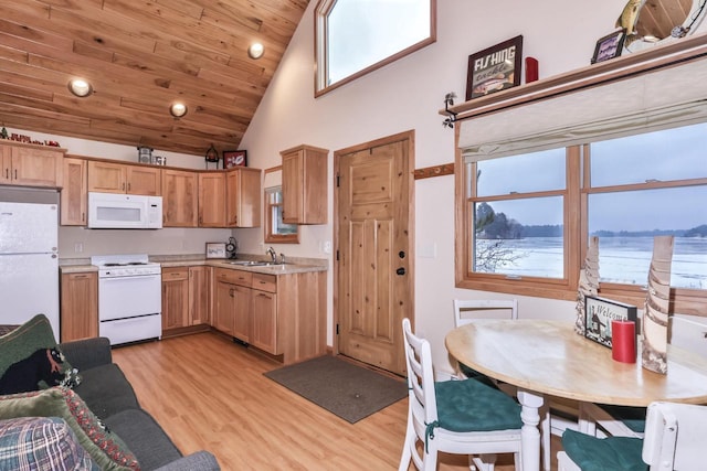 kitchen with white appliances, wood ceiling, light wood-style flooring, light countertops, and a sink