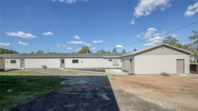 rear view of house with a yard