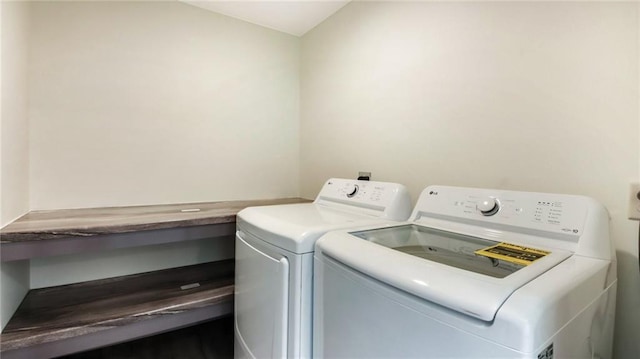 clothes washing area featuring laundry area and washer and dryer