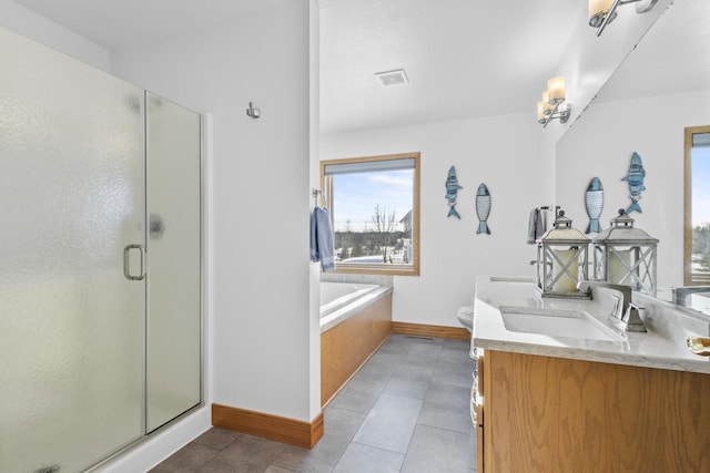 bathroom with baseboards, tile patterned flooring, vanity, a shower stall, and a bath