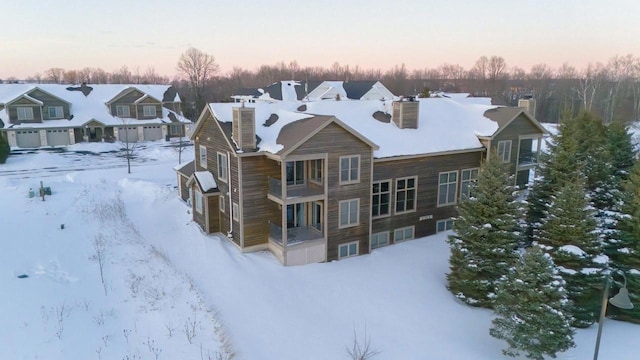 exterior space with a chimney and a residential view