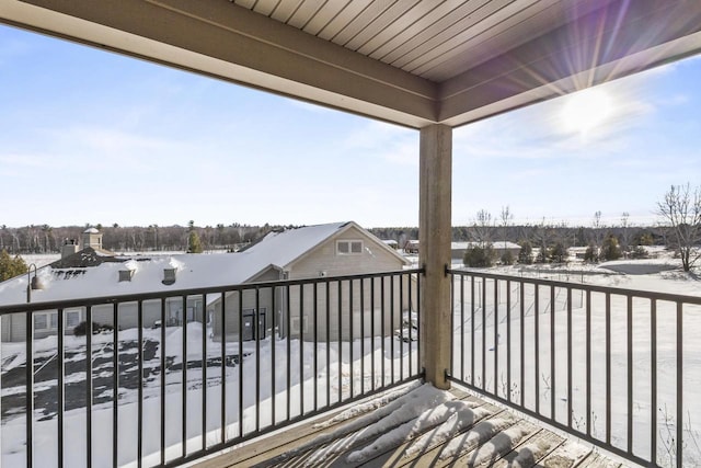 view of snow covered deck