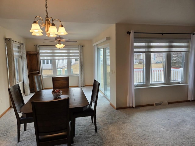 dining room featuring a ceiling fan, carpet flooring, visible vents, and baseboards