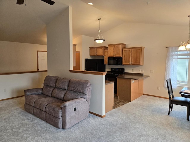 kitchen featuring dark countertops, brown cabinets, carpet, black appliances, and pendant lighting