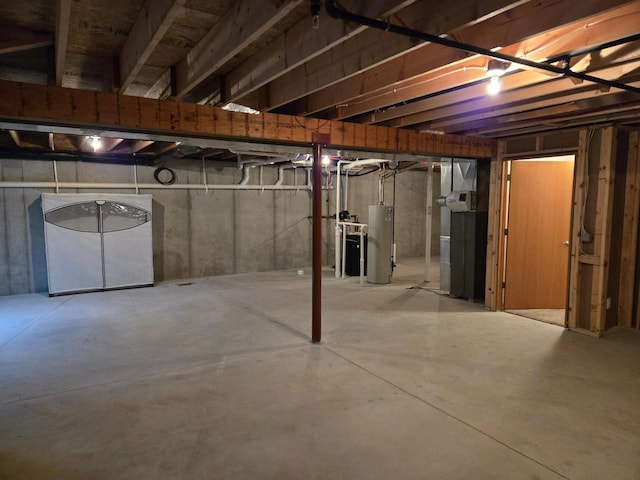 unfinished basement featuring gas water heater