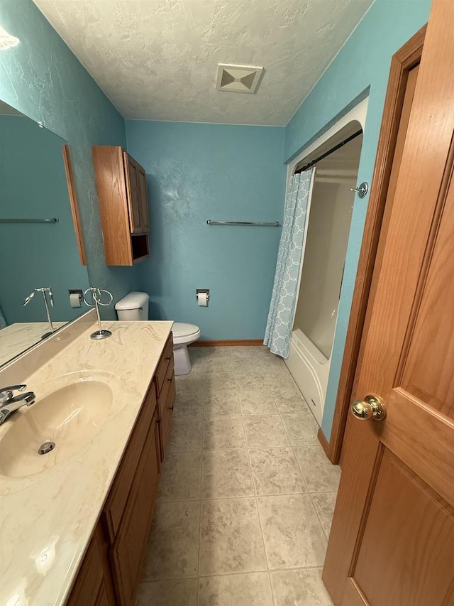 bathroom with shower / tub combo, baseboards, toilet, a textured ceiling, and vanity