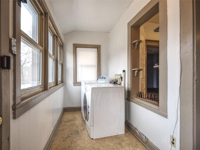 washroom featuring laundry area, independent washer and dryer, and baseboards