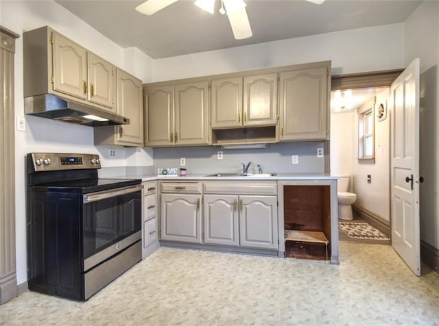 kitchen featuring open shelves, light countertops, stainless steel range with electric cooktop, a sink, and under cabinet range hood