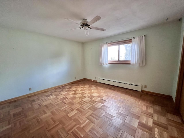 empty room with a ceiling fan, baseboards, and baseboard heating