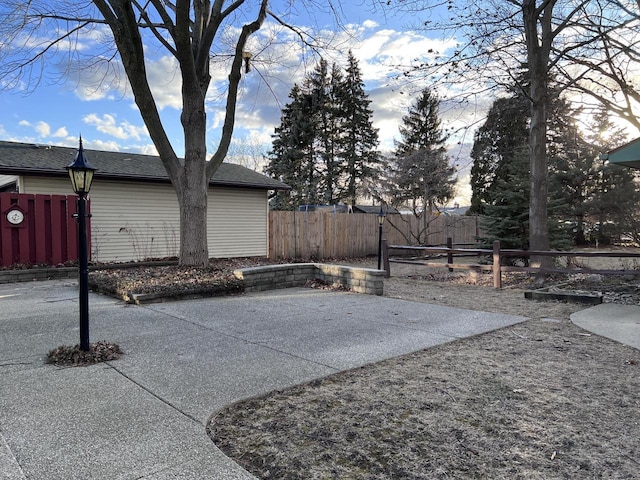 view of patio / terrace featuring fence