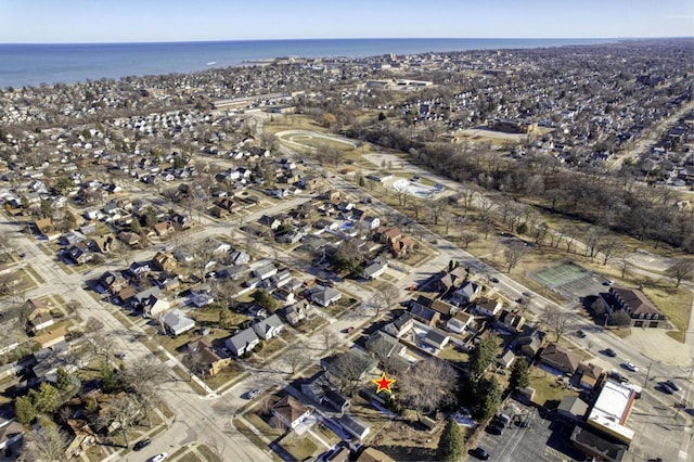 birds eye view of property with a water view and a residential view