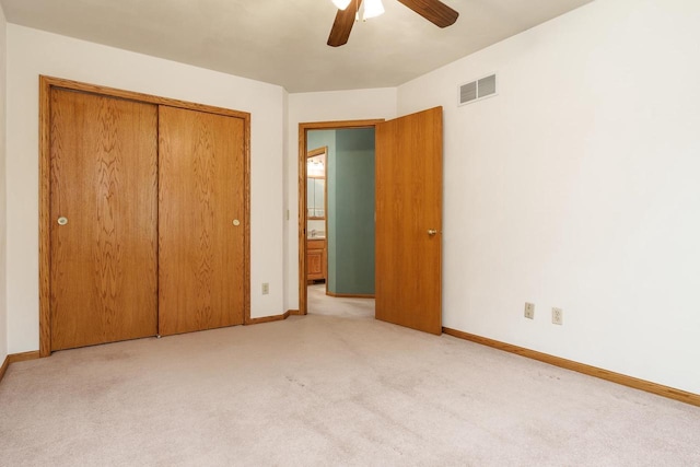 unfurnished bedroom with baseboards, visible vents, a ceiling fan, carpet flooring, and a closet