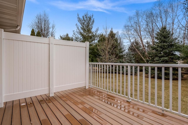 wooden terrace with a lawn