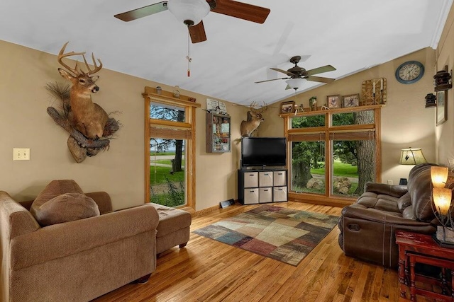 living room with vaulted ceiling, wood finished floors, and a ceiling fan