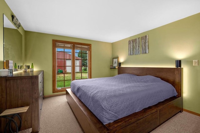 carpeted bedroom with baseboards