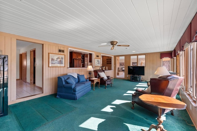 sunroom / solarium with visible vents and a ceiling fan