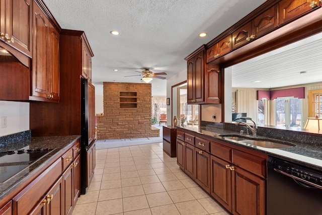 kitchen featuring dark stone countertops, light tile patterned flooring, a sink, black appliances, and a textured ceiling