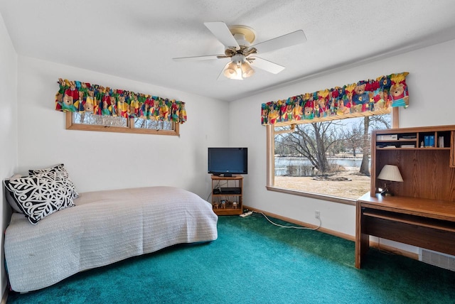 bedroom with a ceiling fan, baseboards, and carpet floors