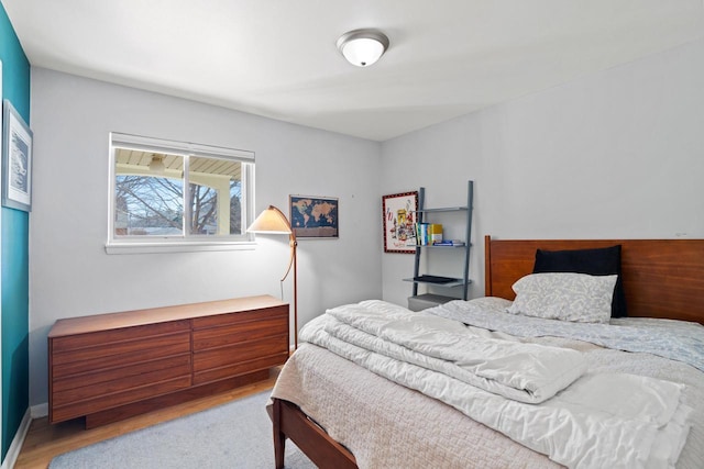 bedroom with wood finished floors