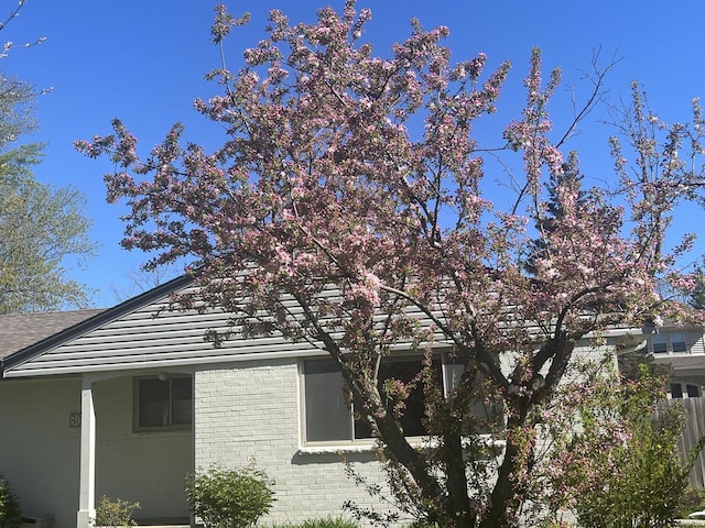 view of property exterior with brick siding