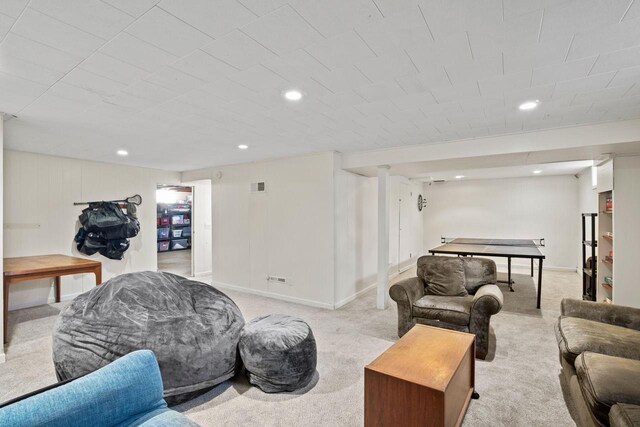 living room with recessed lighting, light colored carpet, visible vents, and baseboards