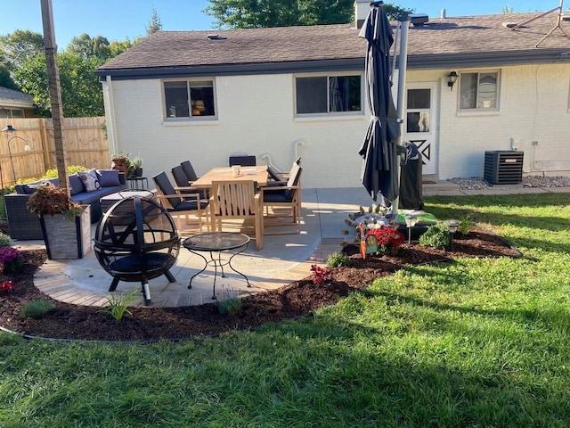 back of property featuring central air condition unit, an outdoor living space, fence, brick siding, and a patio area