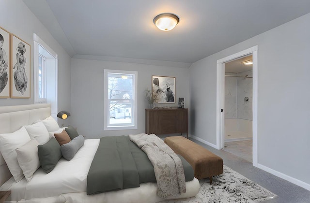 bedroom with carpet floors, ensuite bath, and baseboards