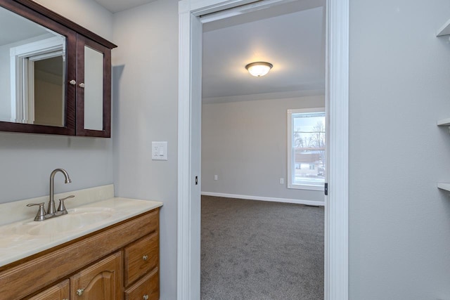 bathroom featuring vanity and baseboards