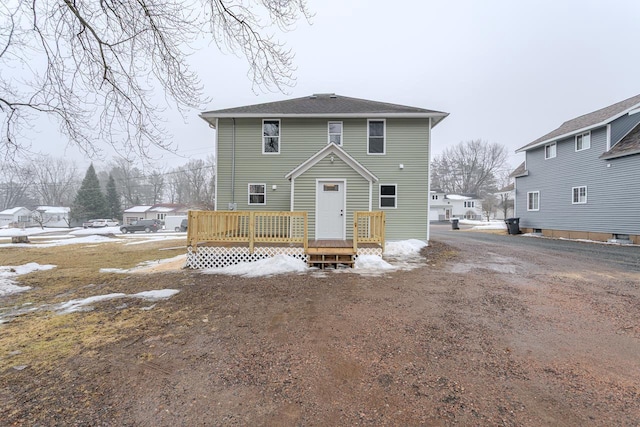 rear view of house featuring a deck