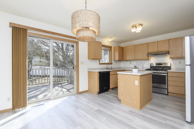 kitchen with under cabinet range hood, a sink, light countertops, dishwasher, and stainless steel gas range