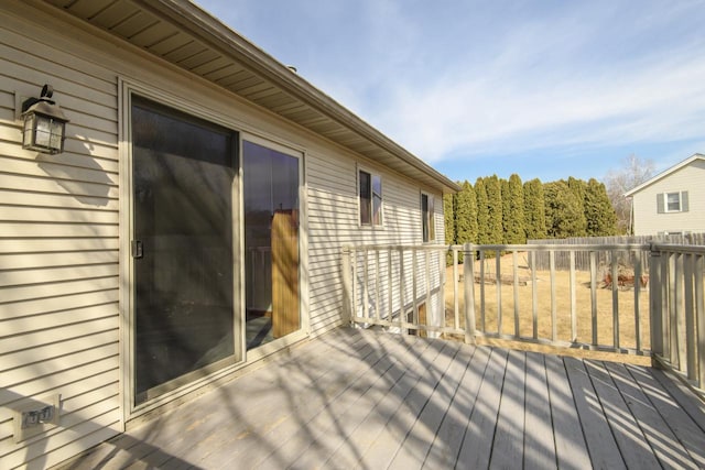 wooden terrace featuring fence