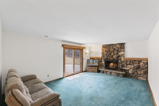 living area featuring carpet and a fireplace