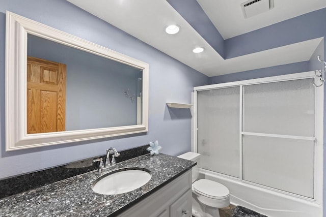 bathroom with visible vents, toilet, recessed lighting, shower / bath combination with glass door, and vanity