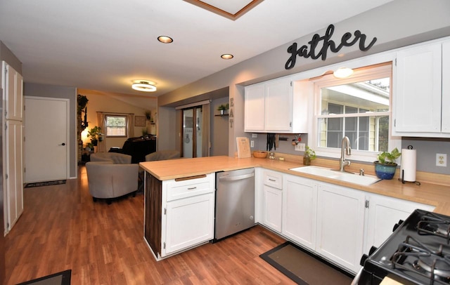 kitchen with dishwasher, a peninsula, light countertops, white cabinetry, and a sink