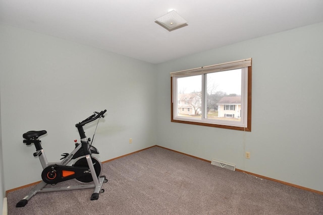 workout area featuring carpet, visible vents, and baseboards