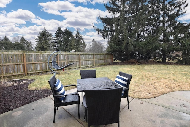 view of patio featuring outdoor dining space and a fenced backyard