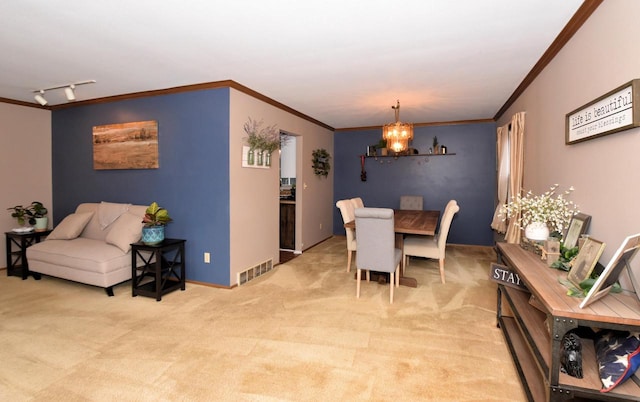 dining space featuring an inviting chandelier, visible vents, crown molding, and light colored carpet