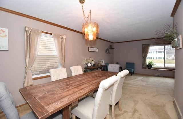 dining room featuring ornamental molding, light carpet, baseboards, and an inviting chandelier