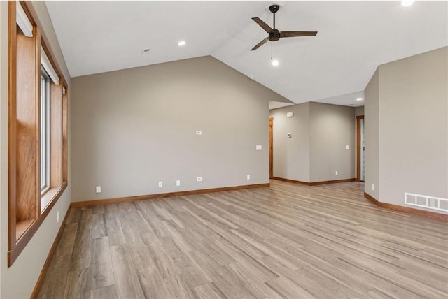 497 Westwood Dr, River Falls, WI 54022 - empty room featuring light wood-type flooring, baseboards, visible vents, and lofted ceiling