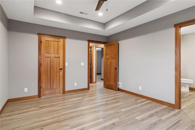 497 Westwood Dr, River Falls, WI 54022 - unfurnished bedroom featuring light wood-type flooring, baseboards, and visible vents