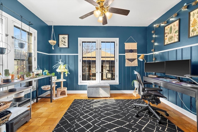 office area featuring ceiling fan, french doors, a wealth of natural light, and baseboards