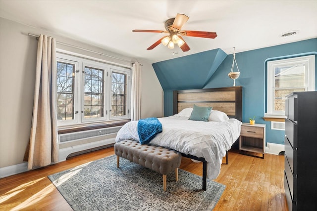 bedroom featuring light wood-type flooring, baseboards, and visible vents