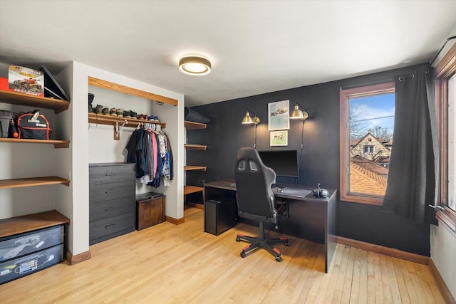 office area with wood finished floors and baseboards