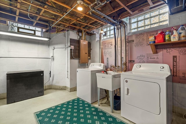 laundry room featuring laundry area, electric panel, and independent washer and dryer