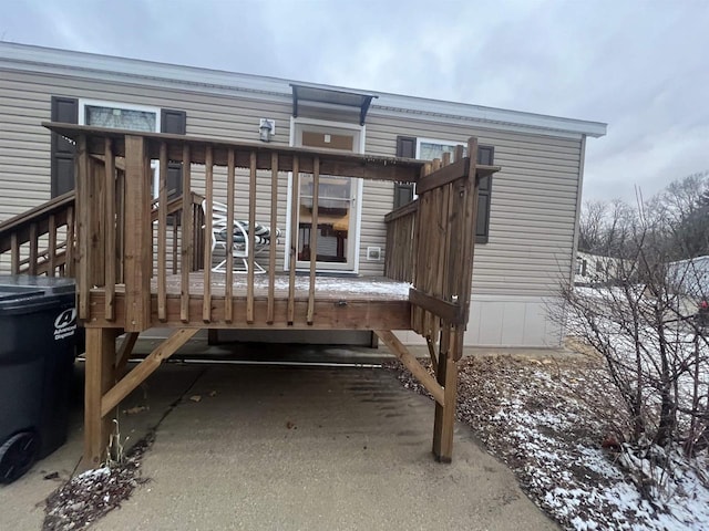 back of house with a wooden deck