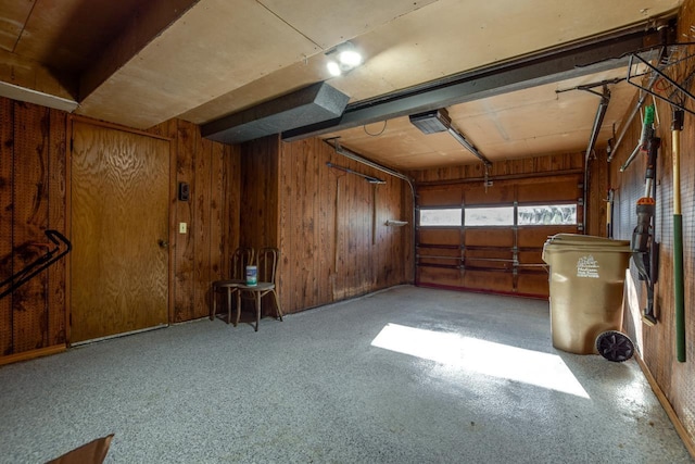 garage featuring wooden walls