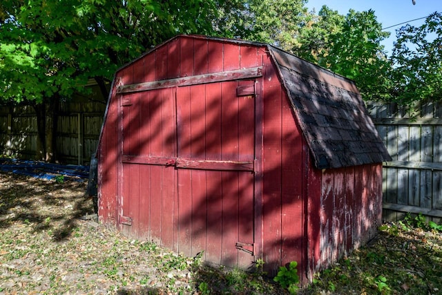 view of shed with fence